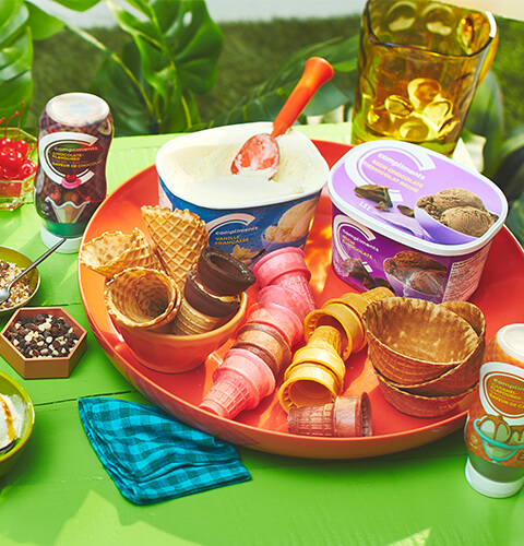 party-ice-cream Backyard table setting for an ice cream party, with full ice cream sundae bar and ice cream party supplies