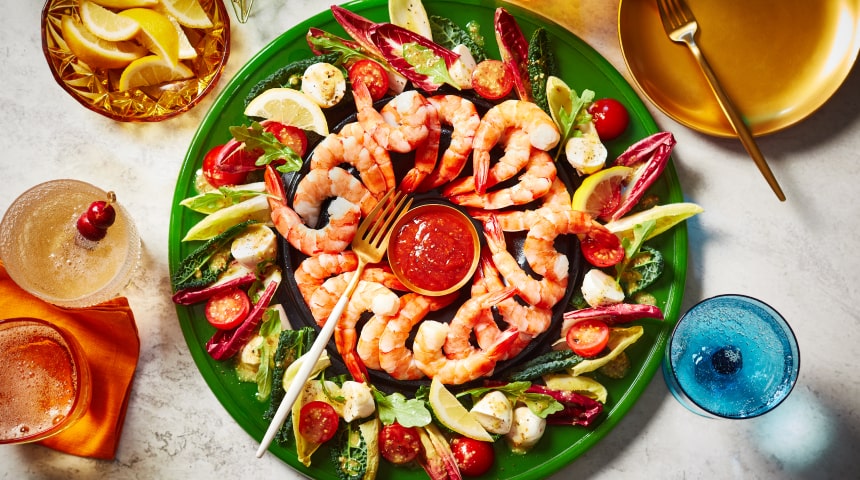 Wreath-style shrimp ring appetizer, made with with an edible salad garnish around the ring