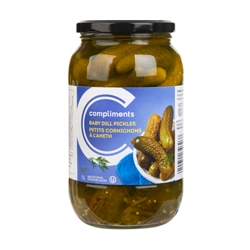 Jar of pickles on orange background