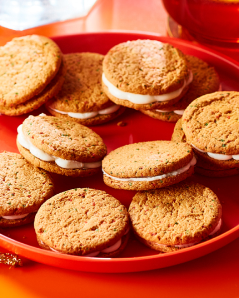 Winter_holiday try me Plate of Compliments Mistletoe wish cookies beside a cup of cider and a box of the cookies