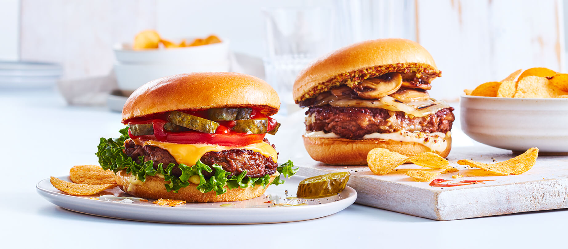 Classic Americana burger and Dutch-style bistro burger on a white background
